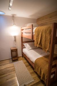 Postel nebo postele na pokoji v ubytování Palafito Loft
