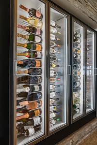 a walk in wine cellar with wine bottles at Adams Beach Hotel & Spa in Ayia Napa