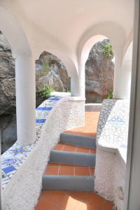 a set of stairs with blue and white tiles at Villa Marecoco in Ischia