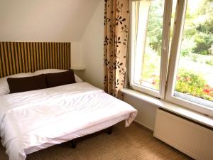Postel nebo postele na pokoji v ubytování Apartament Natura