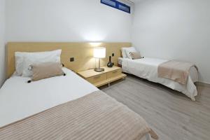 A bed or beds in a room at Villa Blue Marlin 4 Még 16 kép