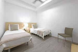 A bed or beds in a room at Villa Blue Marlin 4