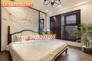 a bedroom with a large bed and a large window at FLC Sea CHANH Apartment - Căn Hộ Hướng Biển Trung Tâm TP Quy Nhơn in Quy Nhon