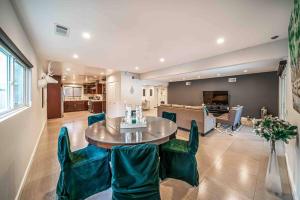 a living room with a table and chairs at Luxury house pool & Spa 10 mins from Hollywood & Universal Studios in Los Angeles