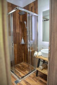a bathroom with a shower and a sink at Aelia Mount Suites in Zagora
