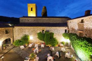 a large building with a bunch of animals on top of it at Castello di Spaltenna Exclusive Resort & Spa in Gaiole in Chianti