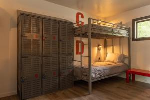 a bedroom with a bunk bed and a locker at The Junction Hotel and Hostel in Durango