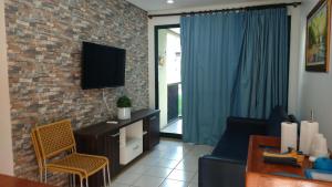 Televisyen dan/atau pusat hiburan di Marulhos Suites