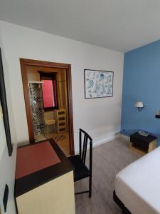 A bed or beds in a room at Hotel Milano San Giovanni Lupatoto