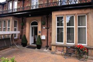 a house with a bike parked in front of it at Eildon Guest House in Inverness