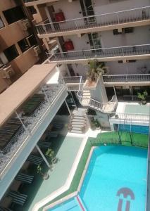 an aerial view of an apartment building with a swimming pool at Windsor Hotel Luxor in Luxor