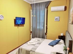 Postel nebo postele na pokoji v ubytování Rose Guest House