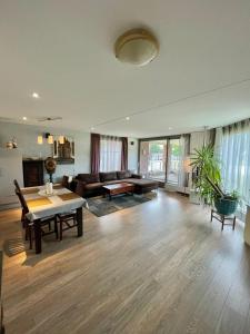 a living room with a couch and a table at Lounge Park Apartment in Amsterdam