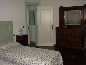 En eller flere senge i et værelse på La Corte Del Cavaliere Bed & Breakfast