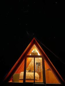 a room with a window in the front of a tent at A-FRAME CABIN PUCON in Pucón