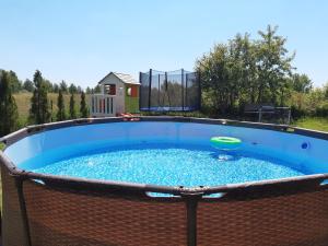 a large circular pool with a frisbee in it at U Rybaka in Mielenko