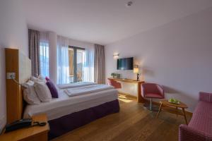 Postel nebo postele na pokoji v ubytování Active & Family Hotel Gioiosa