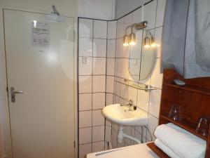 Ванная комната в Hotel Schroder