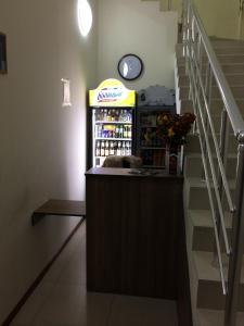 a drink bar with a clock on the wall at Star Hotel Didube in Tbilisi City