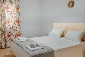 Postel nebo postele na pokoji v ubytování THALASSA ALMYROS APARTMENTS