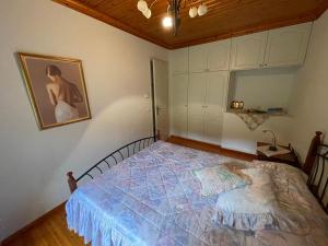 a bedroom with a bed in a room at Petra Maisonettes in Kariá