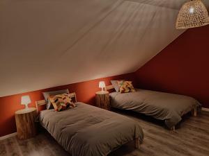 a bedroom with two beds in a tent at Gîte 28 court in Bastogne