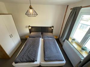 Łóżko lub łóżka w pokoju w obiekcie Apartmány U Medvěda