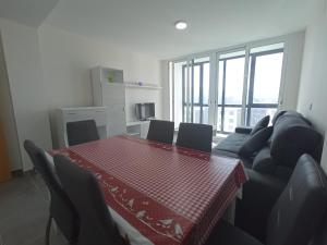 a living room with a table and a couch at Palmeiro in Jove