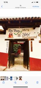 an entrance to a house with a sign on it at Hotel del Pozo in San Sebasti&aacute;n del Oeste