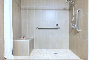 a bathroom with a shower with a toilet at Days Inn by Wyndham Santa Monica/Los Angeles in Los Angeles