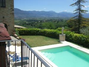 a swimming pool on the balcony of a house at B&B La Noce in Montefalco