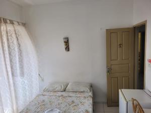 Ein Bett oder Betten in einem Zimmer der Unterkunft Hotel Pousada Catarina Mina