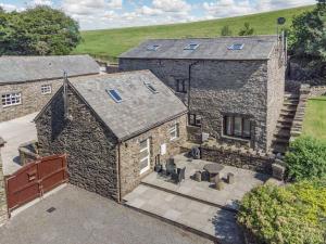 an aerial view of a stone house with a courtyard at Thimble Cottage in Ulverston