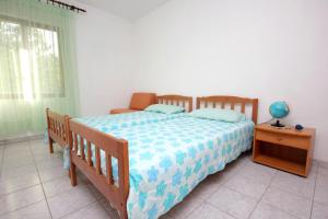 Postel nebo postele na pokoji v ubytování Apartments with parking spaces Zaglav, Dugi otok - 878