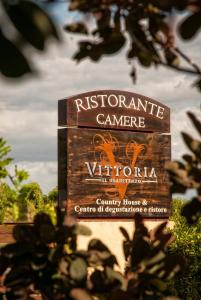 a sign for the registrar for the victoria at Vittoria Il Graditempo Country House in Rosora