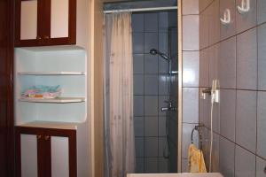 a bathroom with a shower with a shower curtain at Holiday house with WiFi Postira, Brac - 701 in Postira