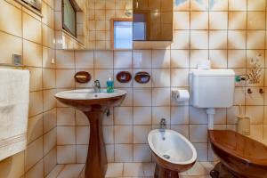 a bathroom with a toilet and a sink at Apartments by the sea Sumartin, Brac - 758 in Sumartin +22 photos