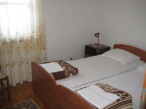 Ένα ή περισσότερα κρεβάτια σε δωμάτιο στο Apartment Maslinica 774b