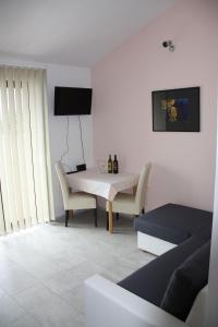 a living room with a white table and chairs at Apartments and rooms by the sea Zaklopatica, Lastovo - 994 in Lastovo