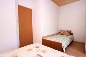 Postel nebo postele na pokoji v ubytování Apartment Zman 887c
