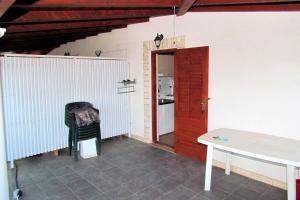 a room with a table and a door to a kitchen at Apartments with a parking space Kraj, Pasman - 696 in Tkon