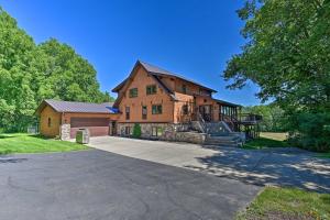 a large brick house with a garage at Lodge with Indoor Pool, Along Devils Lake Park in Merrimac