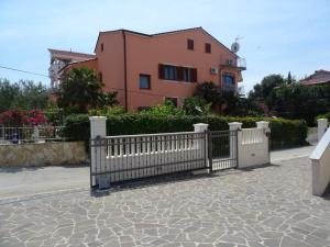 a white fence in front of a house at Apartments with a parking space Biograd na Moru, Biograd - 860 in Biograd na Moru