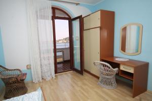 a room with a mirror and a desk and chairs at Apartment Kali 834a in Kali