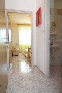 a room with a bathroom with a sink and a toilet at Apartments by the sea Kali, Ugljan - 834 in Kali