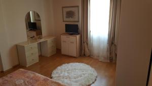 a bedroom with a mirror and a white rug at Apartment Sali 890b in Sali