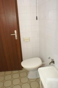 a bathroom with a toilet and a sink at Apartment Pisak 967b in Mimice