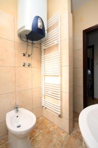a bathroom with a toilet and a sink at Apartment Seget Vranjica 1051b in Seget Vranjica