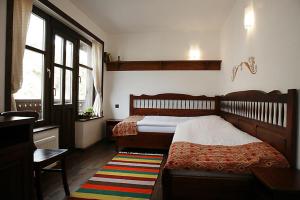מיטה או מיטות בחדר ב-Family Hotel Arkan Han
