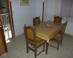 a dining room table with chairs and a bowl on it at Apartments by the sea Postira, Brac - 738 in Postira